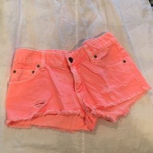 Carmar orange distressed shorts